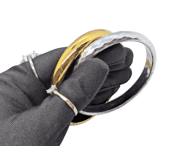 Glossy Goldtone & Faceted Silvertone Bangles Pair 2⅞ Glossy Goldtone & Faceted Silvertone Bangles Pair 2⅞