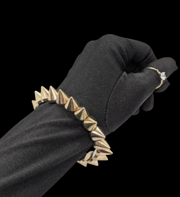 Goldtone Spike Stretch Bracelet – Punk-Inspired Statement Piece Goldtone Spike Stretch Bracelet – Punk-Inspired Statement Piece